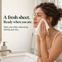 Person patting face dry with a fresh bamboo towel